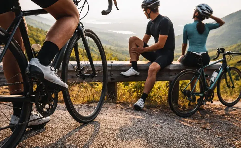 Pain during cycling vs after cycling illustrated by riders resting and stretching after a ride