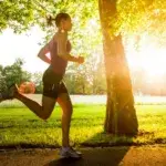 Running 4 miles a day outdoors on a tree-lined path at an easy, steady pace