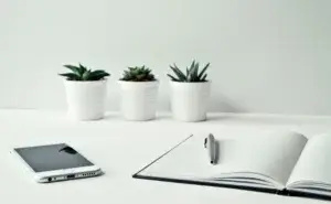 open notebook and pen on a desk used for keeping a running training log