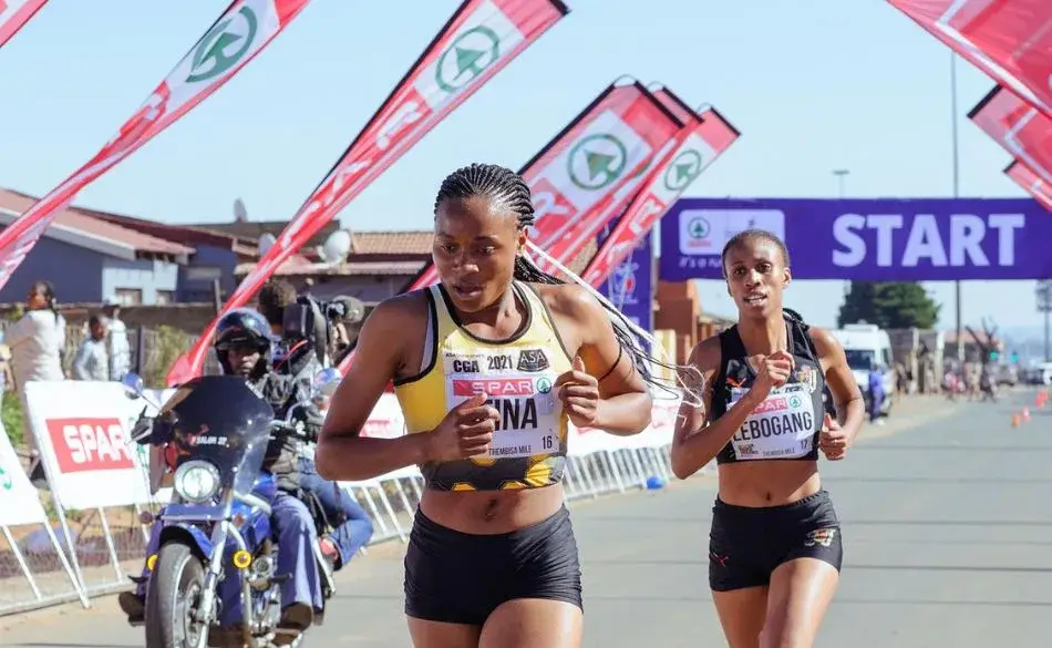 Why athletes need iron shown through runners competing in a road race, highlighting endurance, fatigue resistance, and performance demands