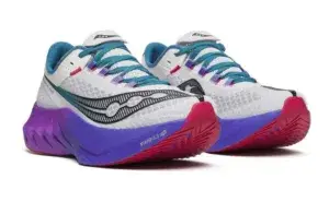 Carbon plate running shoes with thick midsole foam designed for marathon racing