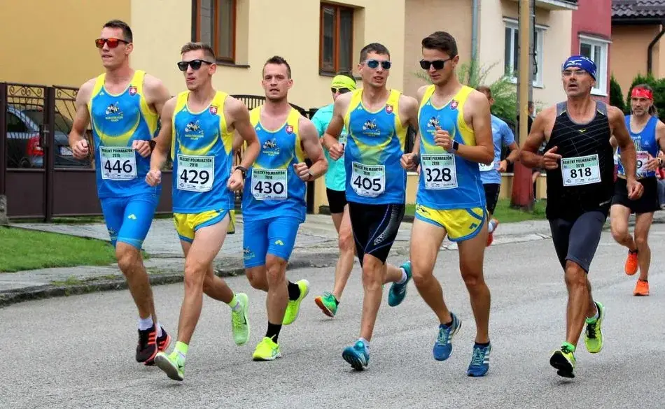 Beginner marathon runners maintaining controlled pace during long run training