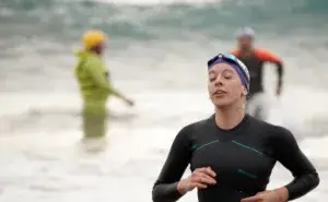 Triathlete pacing the swim leg in a triathlon race