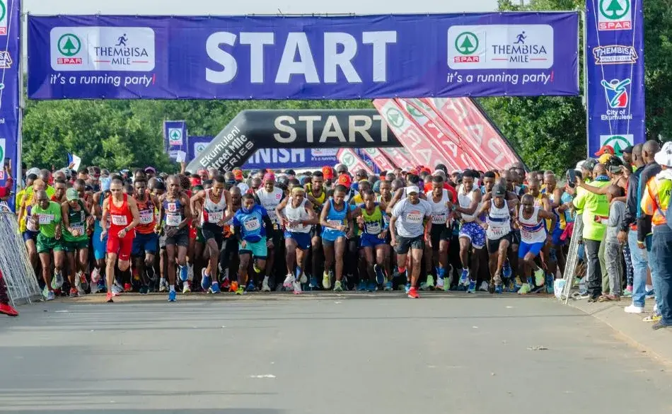 Large group of runners starting a 5K community race, showing why a 5K is so popular with beginners and casual runners